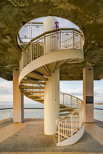 A vertical shot of a spiral staircase on the pier at the Sea Garden in the Bulgarian city of Burgas