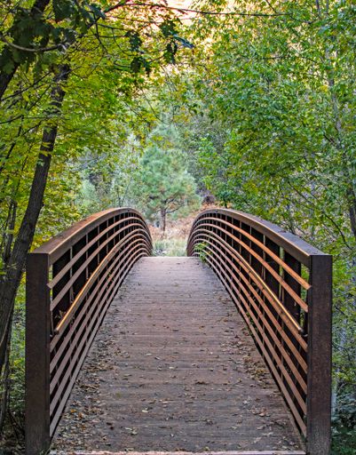 A walking bridge across Oak Creek North of Sedona along the West Fork Trail