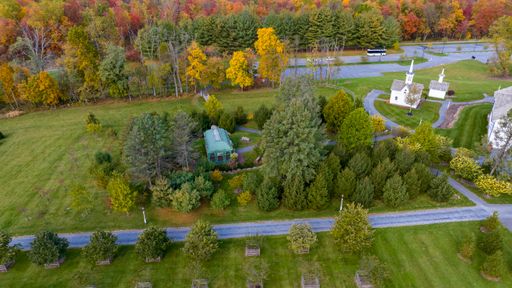 An Aerial View of a Arboretum Gazebo Surrounded by Trees and Shrubs on an Autumn Day