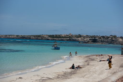 Formentera, Spain: May 29, 2021: People enojy the beach at Es Pujols beach in Formentera in summer 2021