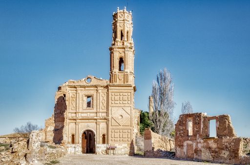 A ruined stone brown building during daytime