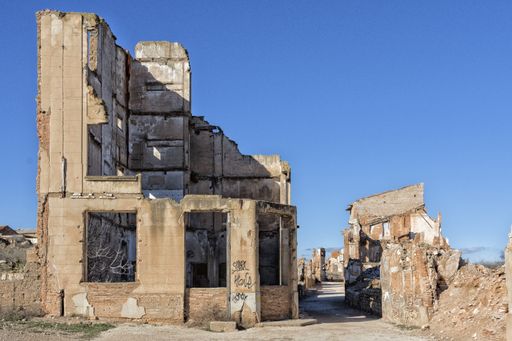 An old ruined building with windows during daytime