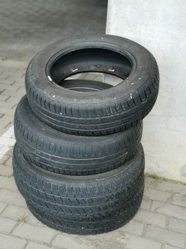 A vertical shot of car wheels stacked on each other