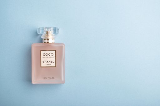 Coco Chanel Mademoiselle on the light blue background