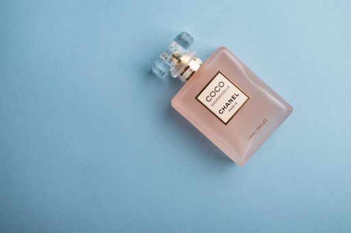 Coco Chanel Mademoiselle on the light blue background