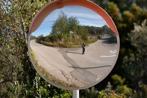 A closeup shot of a concave mirror on the road