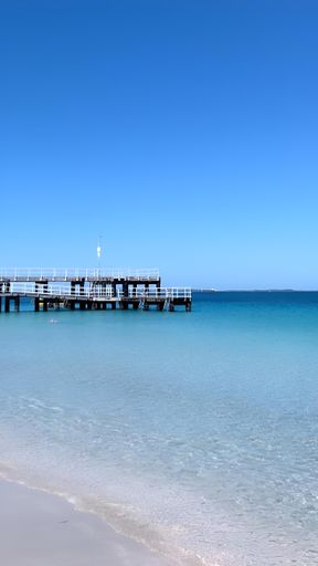 A stunning beach landscape with a sandy shoreline and crystal blue waters