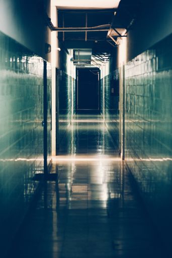 A silhouette of a hospital corridor