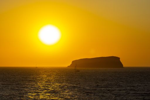 A beautiful view of a sea under the sunset sky background