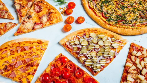 A top view of various pieces of delicious pizza