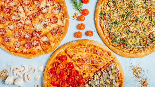 A top view of various pieces of delicious pizza