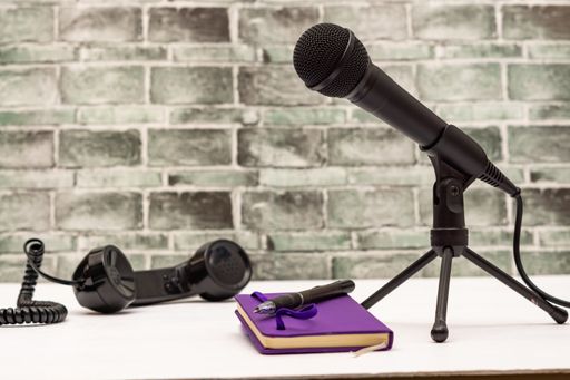 microphone and antique telephone on white background