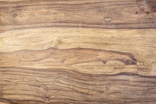 A top view shot of a textured light wooden surface