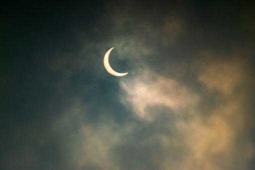 A closeup shot of the half-moon on a night sky