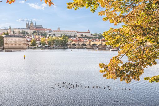 A scenic view of the Vltava river against Prague Castle in the Czech Republic