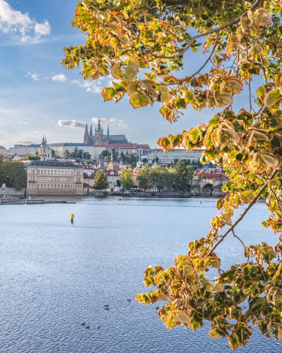 A scenic view of the Vltava river against Prague Castle in the Czech Republic