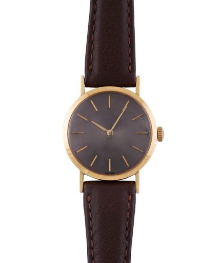 A luxury watch with brown straps isolated on a white background