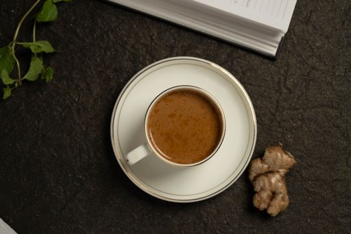 A steaming cup of cappuccino topped with foam