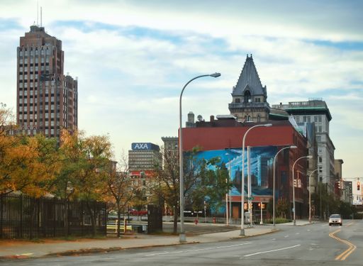 View down South Salina Street , perpendicular to where the Erie Canal once ran with the State Tower Building .