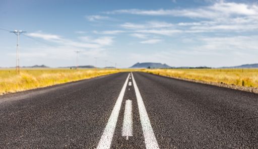 An empty country highway road in the South African Farmland region