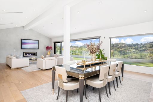 A luxury home features a spacious dining room with stunning views