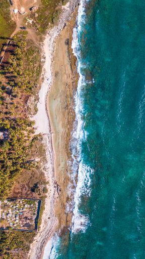 A top view shot of a resort place near the Caribbean beach