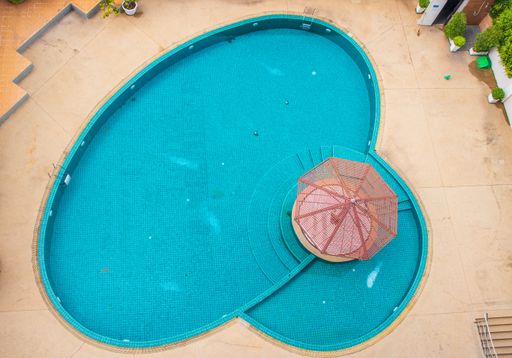 An aerial shot of an outdoor pool