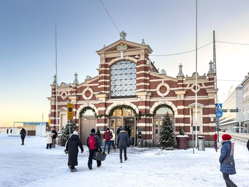 The customers entering the Old Market Hall in Helsinki, Finland in winter
