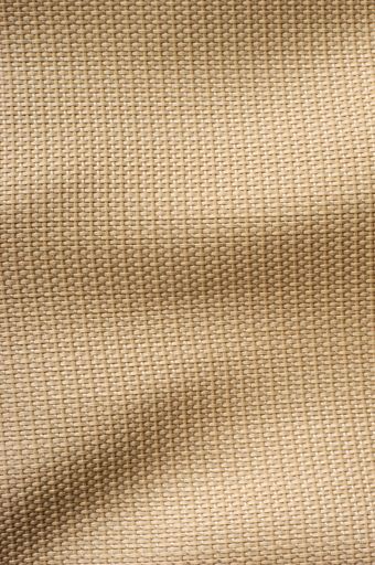 A vertical of a brown woven wavy fabric background