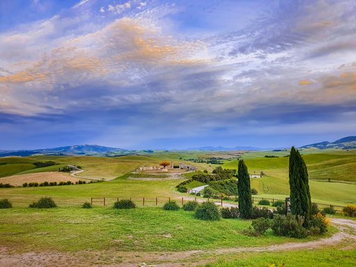 A beautiful shot of green hills and fields in Tuscany