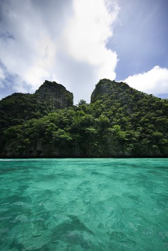 A scenic view of small mountains on the shore of Phi Phi Leh Island in Thailand