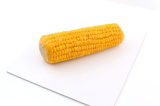 A closeup shot of fresh corn isolated on a white background