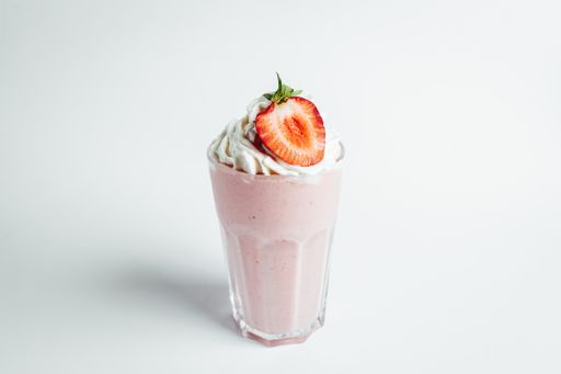 A closeup shot of a strawberry mousse on white background