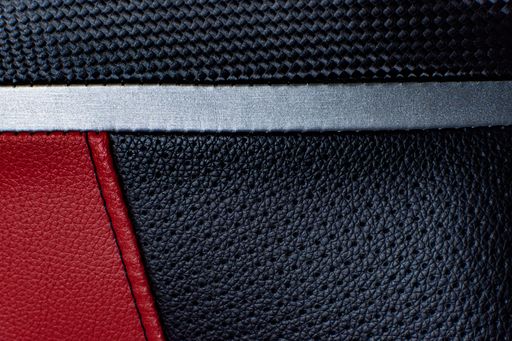 A closeup shot of a red and black leather texture
