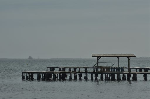 A view of a wooden jetty at a holiday resort at the Mar Menor in Murcia, Spain