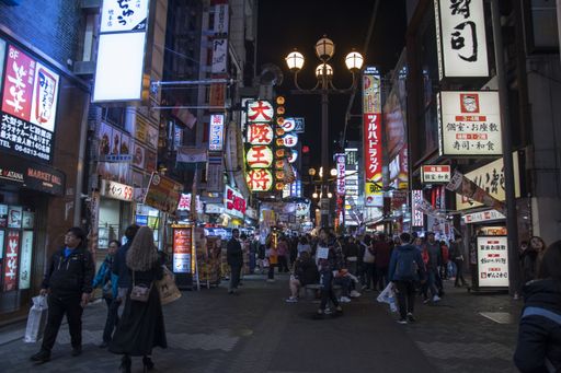 Osaka, Japan- 27 Nov, 2019: Beautiful landscape view of Japanese store with crowd of peoples and tourists at Dotonburi walking street on night time.