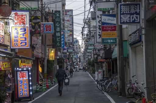 Osaka, Japan- 02 Dec, 2019: Tourist walking around pedestrian walking street at Dotonbori arcade in Namba district of Osaka, Japan