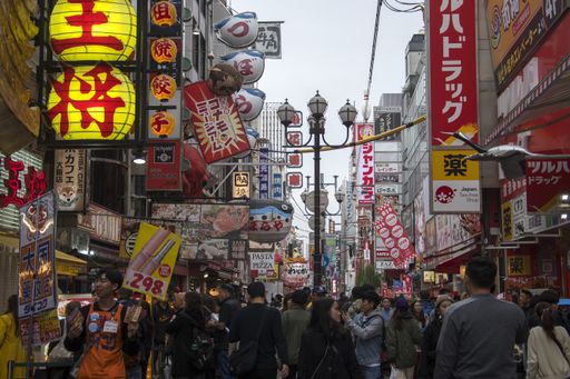Osaka, Japan- 02 Dec, 2019: Tourist walking around pedestrian walking street at Dotonbori arcade in Namba district of Osaka, Japan