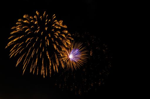 Dark sky with colorful firework blast