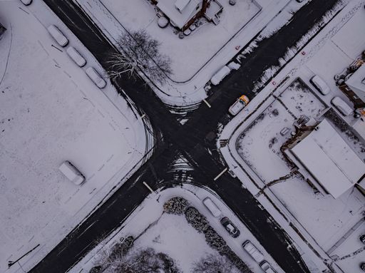 An aerial view over a residential neighborhood intersection on Long Island, New York