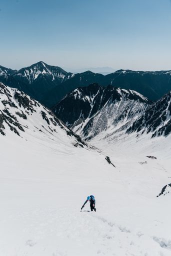 A man ascending a snow mountain in Nagano, Japan