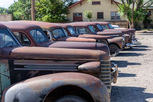 The old vintage US cars at scrapyard in the United States