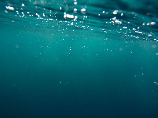 A beautiful underwater shot of focuses detailed water textures - beautiful background