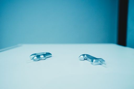 A closeup shot of "4" and "1" candles on a white table