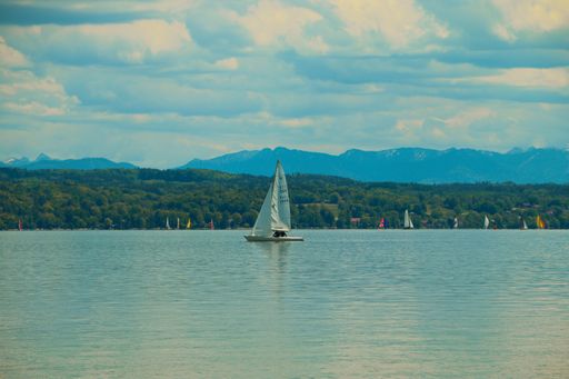 A beautiful shot of a boat sailing on the Starnberger See in Germany