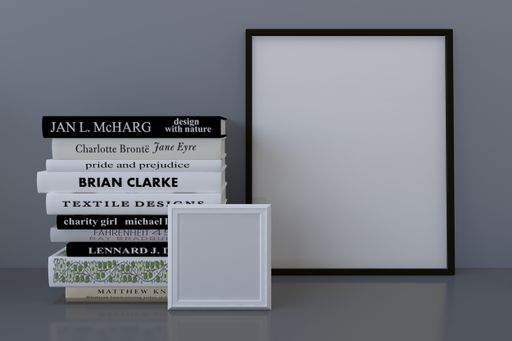 A closeup shot of frames with books on the shelf