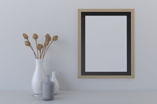 A closeup shot of a frame with a vases on the shelf