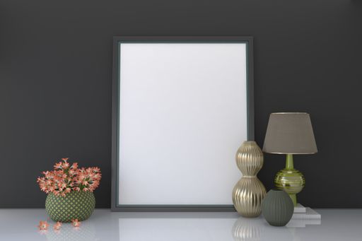 A closeup shot of a frame with decorative items on the table