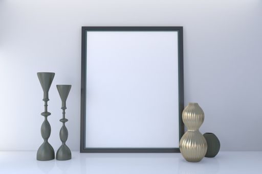 A closeup shot of a frame with decorative items on the table