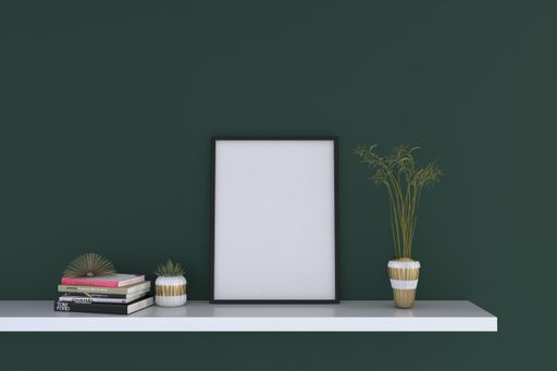 A closeup shot of a black frame with decorative items on the shelf